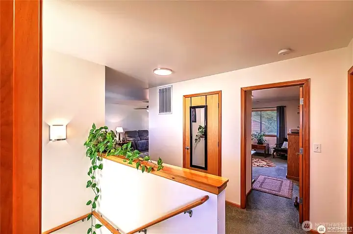 Upstairs landing to 3 bedrooms, full bath and large bonus room.