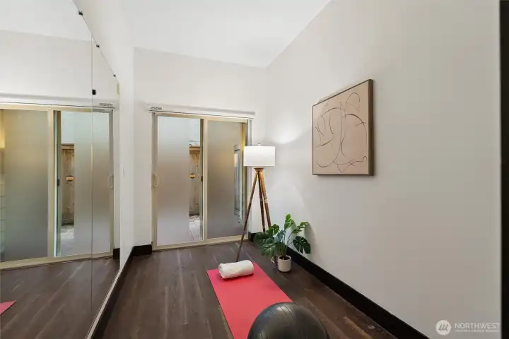 Alternate view of the flexible lower-level room highlighting natural light and generous proportions.