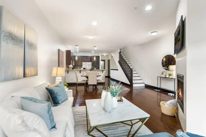 Open-concept layout connecting living, dining, and kitchen areas.