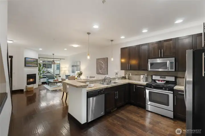 Kitchen featuring extended countertop workspace and abundant cabinetry.