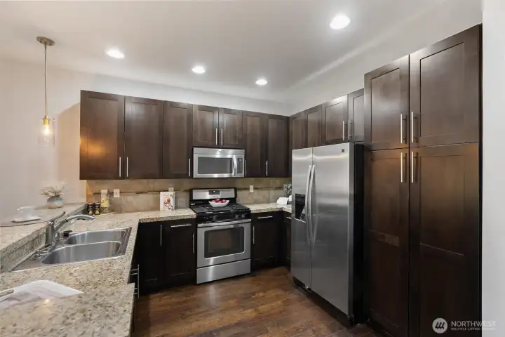 Well-appointed kitchen with stainless appliances and generous storage.
