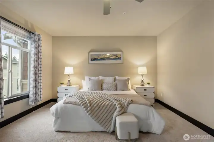 Primary suite with space for seating or additional furniture.