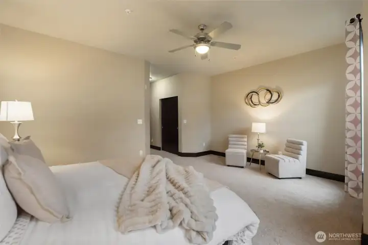 View toward ensuite bath and closet entry from primary bedroom.