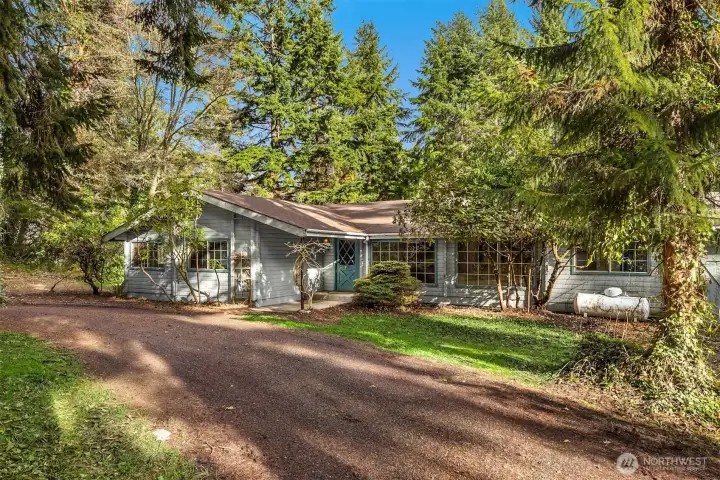 This 1968 Pan Abode-style home invites your imagination and vision.