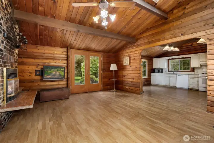 French doors to a patio and expansive back yard...