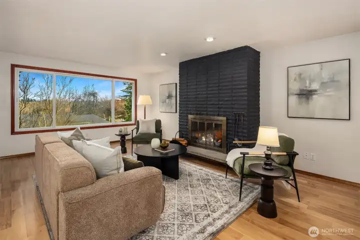 Upstairs living room with oversized picture window and Cascade mountain views.