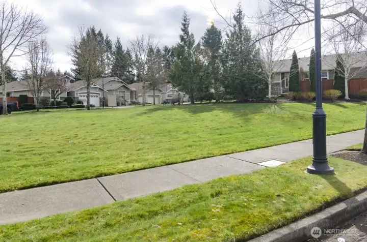 Large green space is located directly across the street.  This area is maintained by the HOA.