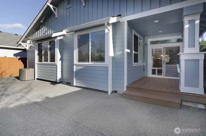 Another view of the back yard is showing covered patio area.
