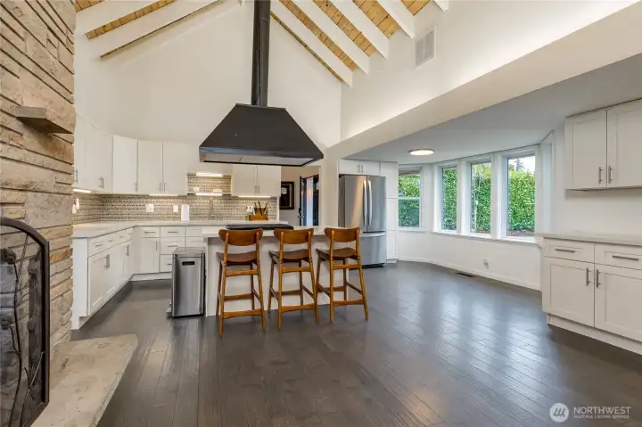 Expansive kitchen boasts cathedral ceilings