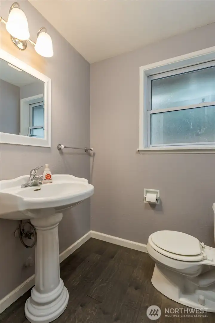 Half bathroom on the main floor, right by the garage entry