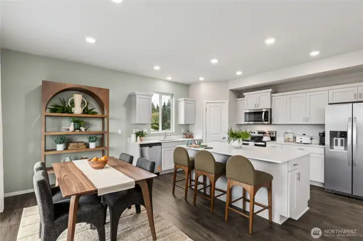 Flex space and kitchen island offer plenty of space.  Refrigerator not included.  Finishes and options will vary.