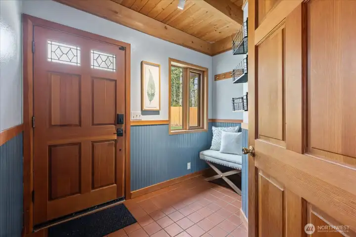 Bright tiled entry to kick off your shoes and hang your jackets