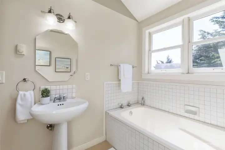 Large upstairs bath with soaking tub.