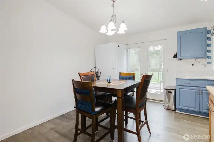 Open floor plan with vaulted ceilings and windows all around.