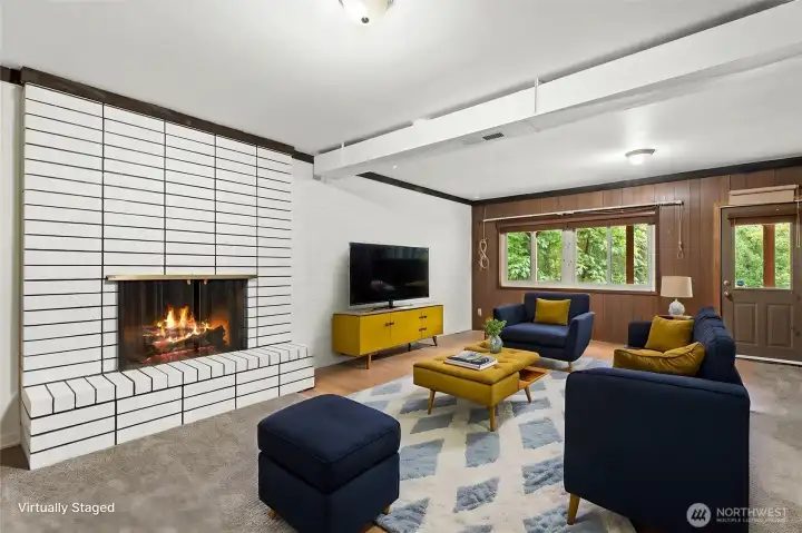 Lower level with wood burning fireplace and outdoor access Lower level with wood burning fireplace and outdoor access