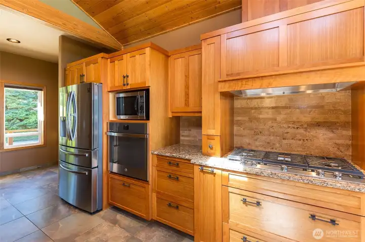 Cherry cabinets and stainless steel appliances