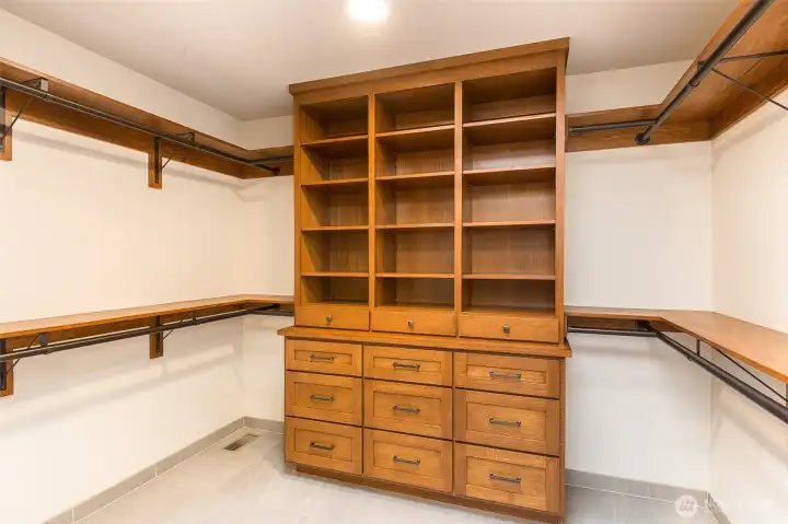Primary suite walk-in closet with built-ins
