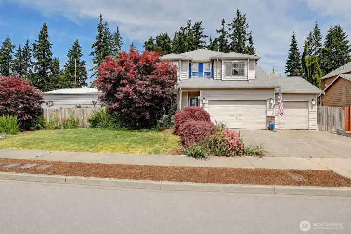 Welcome home! Gorgeous landscaping and an oversized 3-car garage.