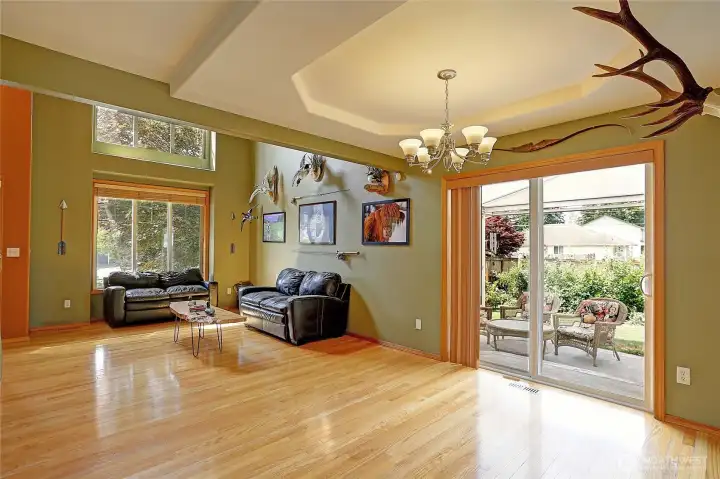 Light-filled great room and dining room opens to the covered patio for easy entertaining.