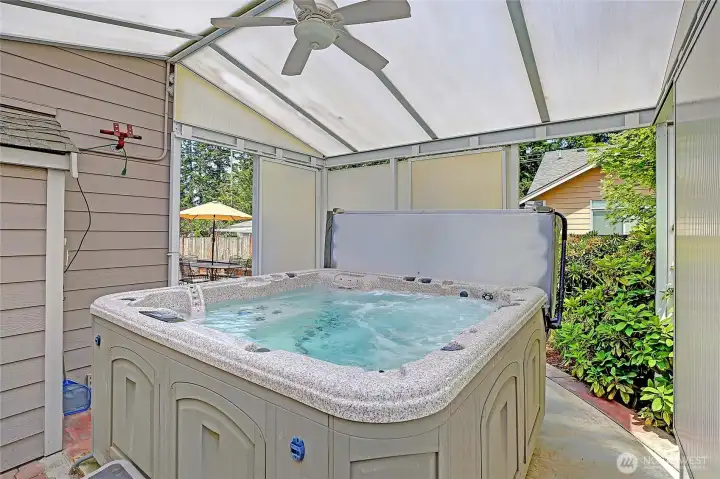 Relax year-round in your private covered hot tub retreat.