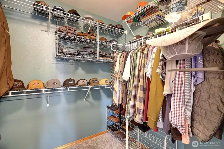 Spacious walk in closet off primary bathroom.