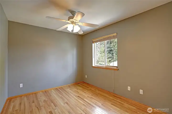 Well-sized bedroom with natural light and spacious closet.
