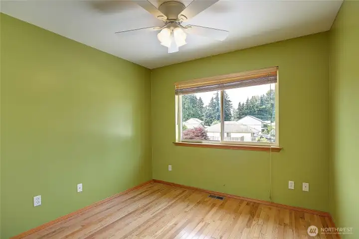 Well-sized bedroom with natural light and spacious closet.