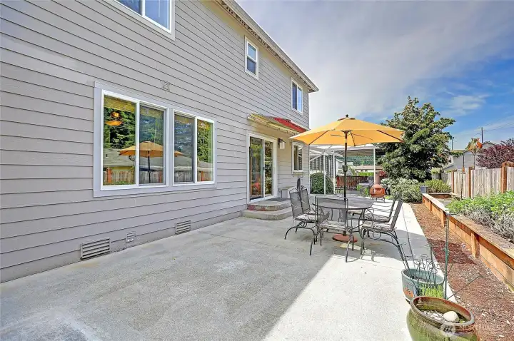 Large patio offers the perfect space for outdoor dining, entertaining, and enjoying the beautifully landscaped backyard.