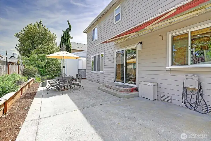 Large patio offers the perfect space for outdoor dining, entertaining, and enjoying the beautifully landscaped backyard.