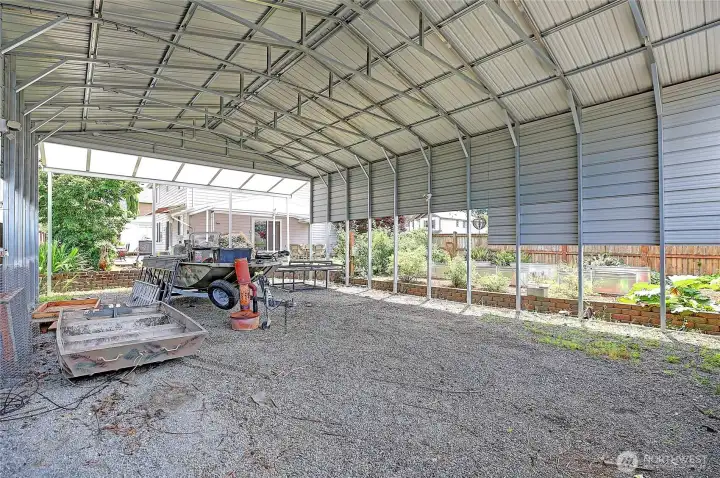 Massive covered RV/boat parking provides space for vehicles, trailers, and recreational toys.