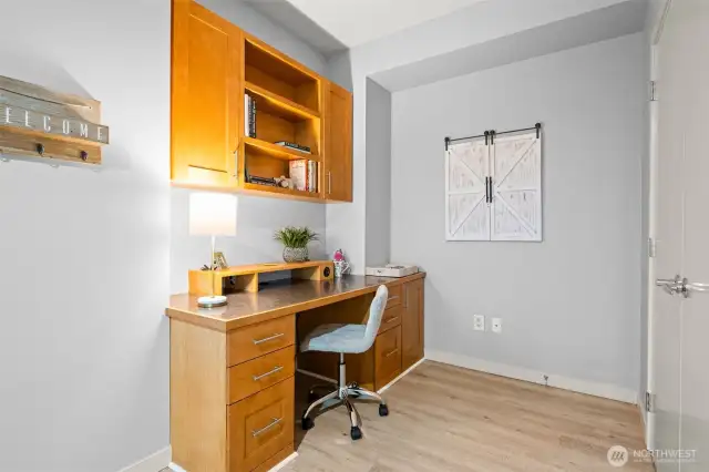 This is where the tour of your new home begins. The home office area is just inside the entry door. The built-in desk is a great feature. Closet doors to the right open to more storage, useful for a pantry and more.