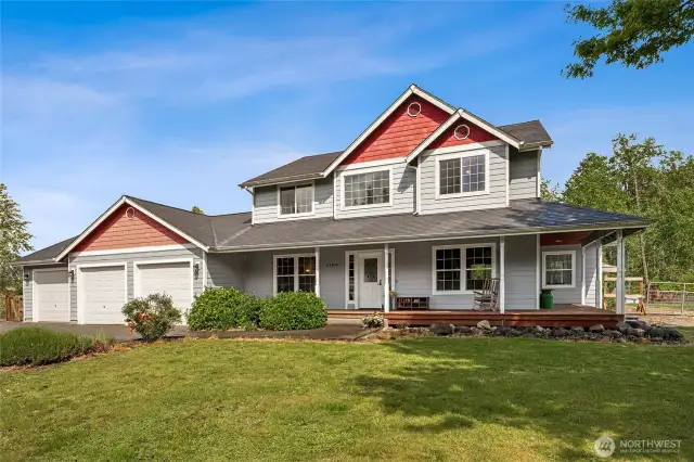 Charming country home with a wraparound porch nestled on a picturesque 5-acre horse property—where rustic elegance meets peaceful country living.