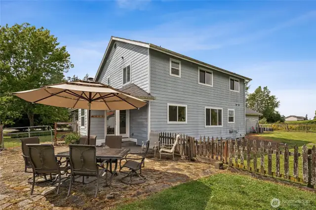 Unwind or entertain on the rear terrace with stunning views across the home’s beautiful open acreage.