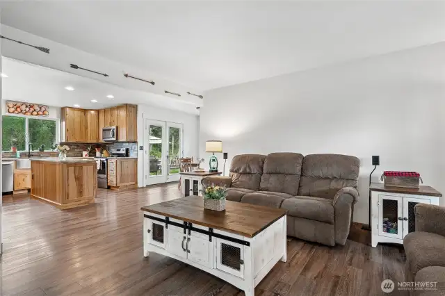 Comfort meets connection with the family room effortlessly transitioning into the kitchen.