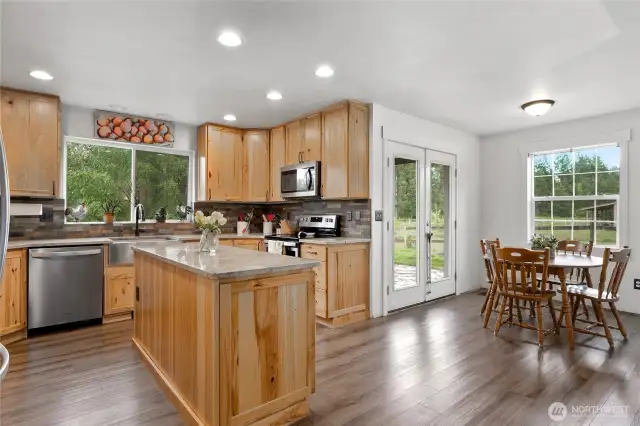 Enjoy easy mornings in the connected breakfast nook just off the beautifully updated kitchen.