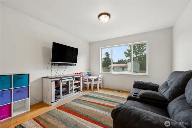 Flexible living: originally a formal dining room, this bright space easily transforms into a playroom, TV room, or craft room.