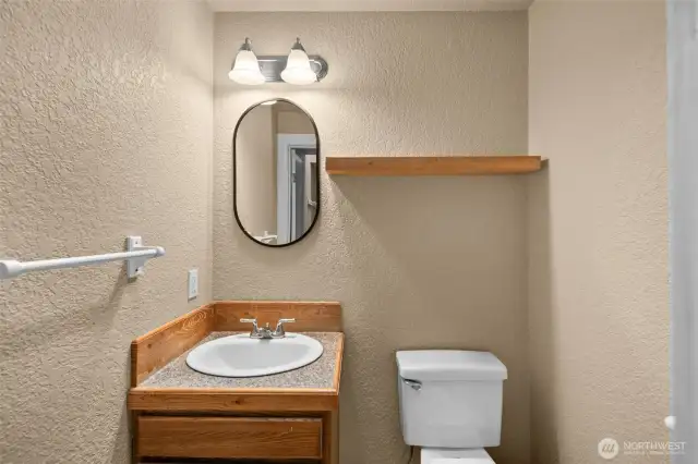 Half bath off conveniently next to garage and kitchen