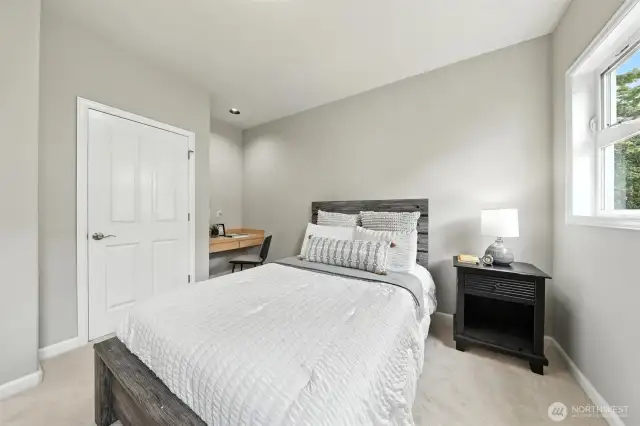 This second bedroom is located on the top floor with new carpeting, a large closet and built-in desk area.