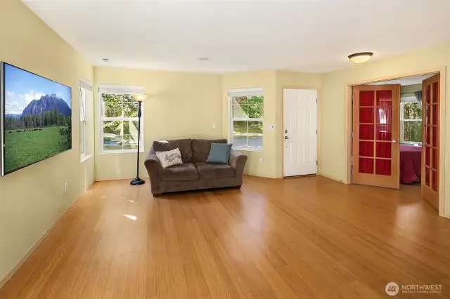 Livingroom off entry with main floor bedroom/office to the right