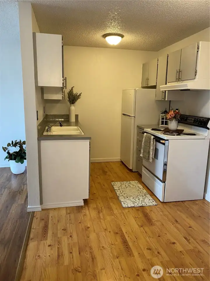 From the bathroom, looking toward kitchen, living area