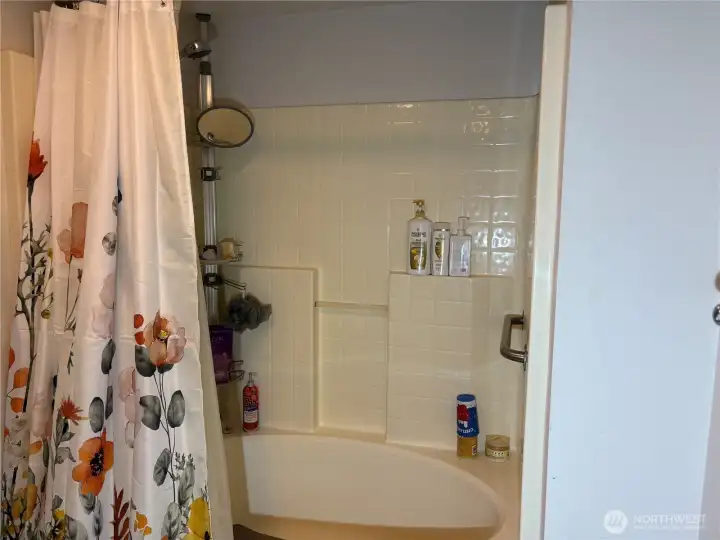 Large soaking tub with shower & safety rails
