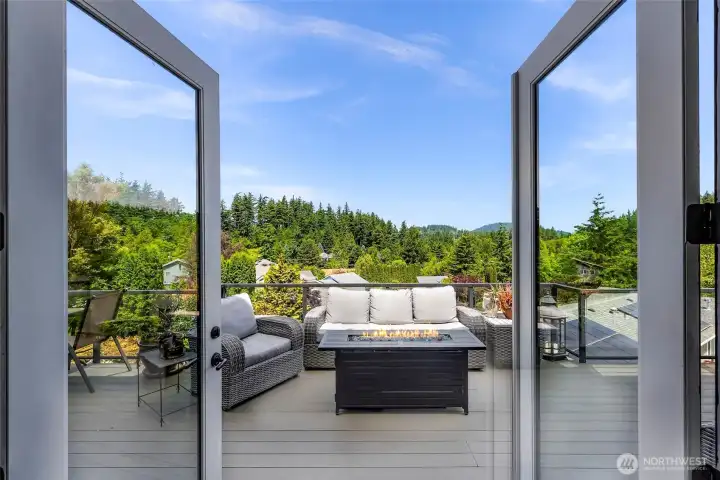 Main floor living room TALL french doors blend inside with outside