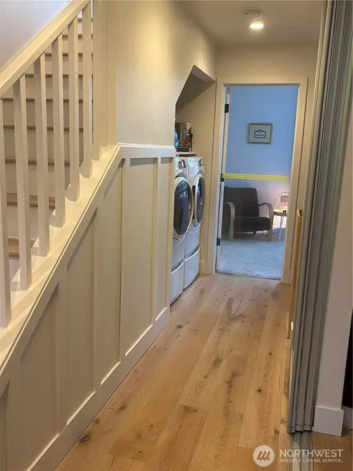 Laundry on ground floor with newer GE appliances.