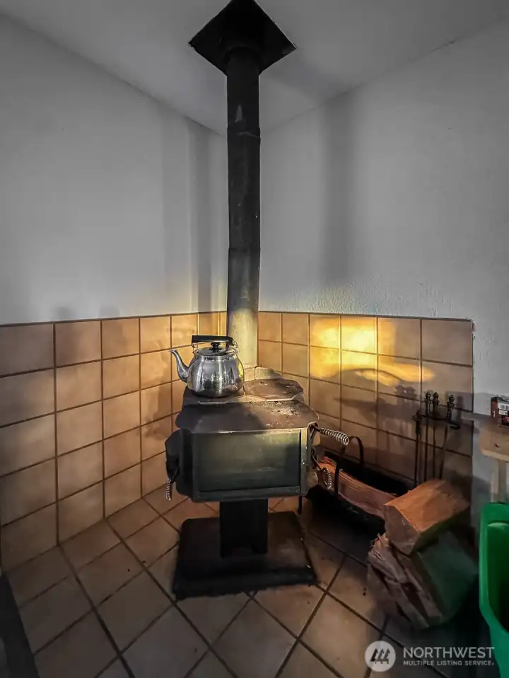 Free-Standing Wood Stove in upper unit