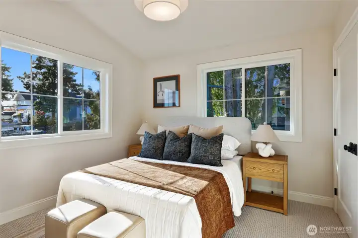 One of three additional bedrooms upstairs with vaulted ceilings and fantastic light.