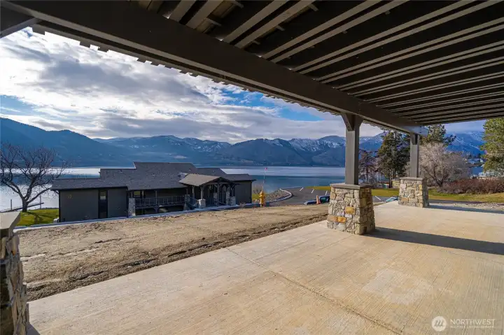 Covered patio extends from the living room area to in front of the primary bedroom.