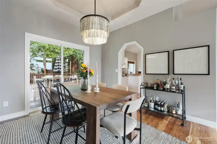 Beautiful tray ceiling in formal dining area! Sliding door access to large deck ...