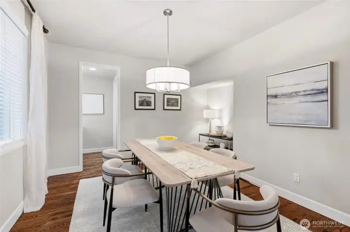 Formal dining room with a nook for a sideboard or other furniture. Peek beyond into the bulter's bar.