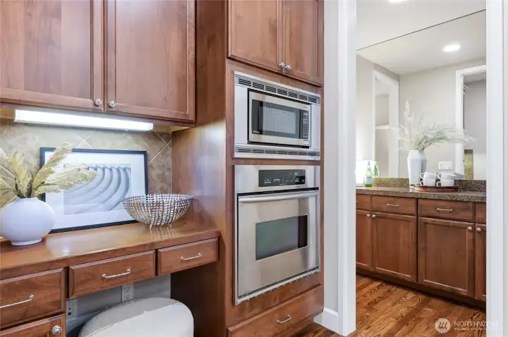 Planning desk is a handy feature. Also notice the extra lighting and peek into the bulter's bar to the dining room.