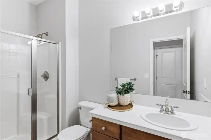 Versatile main floor suite with walk-in closet and en-suite bathroom.